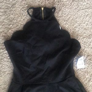 Black dress with scalloped neckline